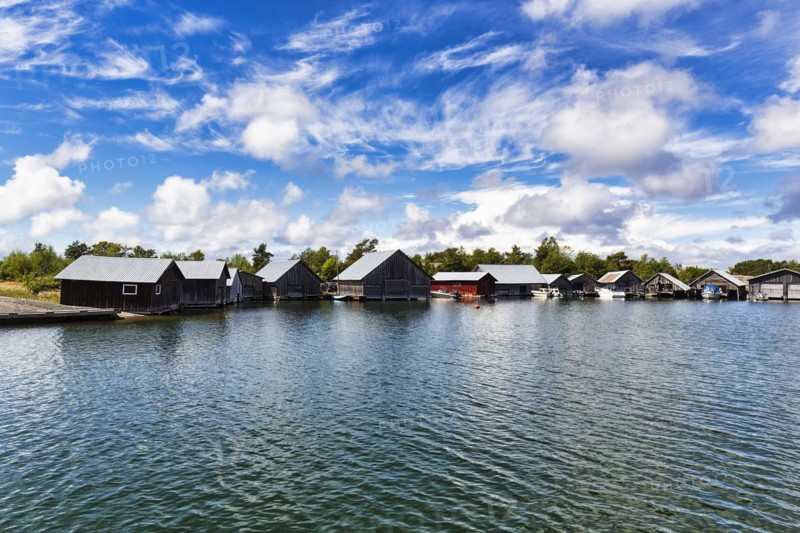 Boathouses in the harbour, Kaeringsund fishing village, backlight, Fasta Aland, Aland Islands, Aland Islands, Finland, Europe