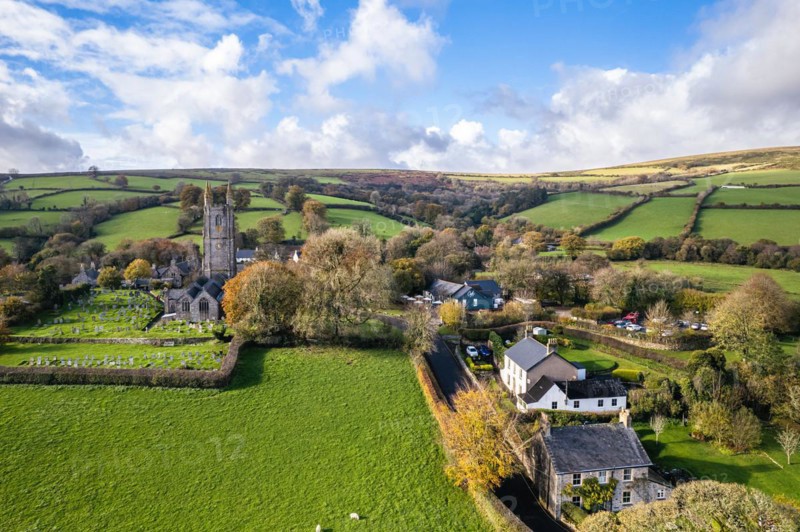 St Pancras Church in Widecombe in the Moor from a drone, Haytor Rocks, Dartmoor National Park, Devon, England, United Kingdom, Europe