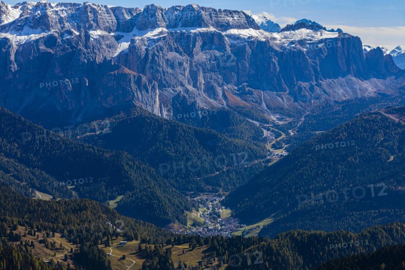 The tourist town of Selva Gardena, view from the Seceda peak, in the background the snow-covered peaks of the Sella massif, Val Gardena, Dolomites, South Tyrol, Italy, Europe