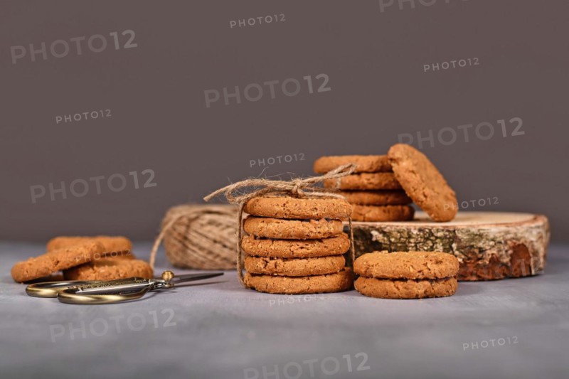 Healthy homemade oat cookies in front of gray background