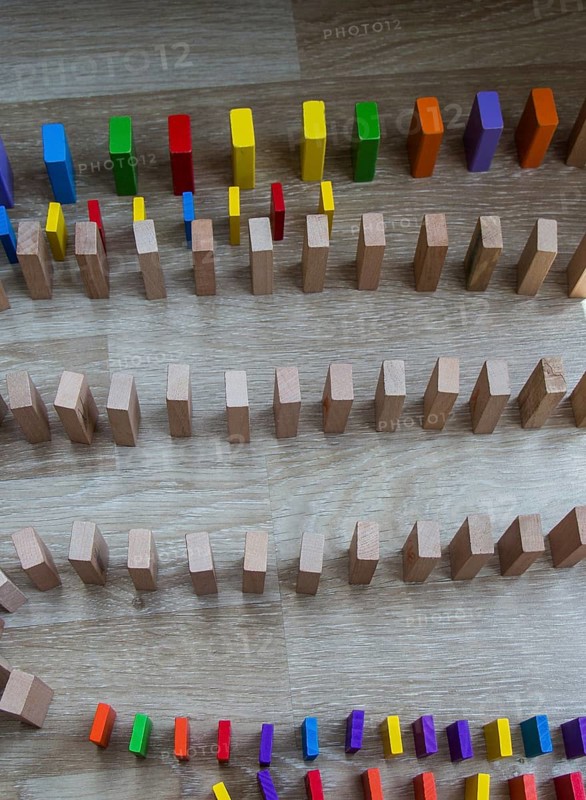 Colorful Domino Blocks in a line on a white background