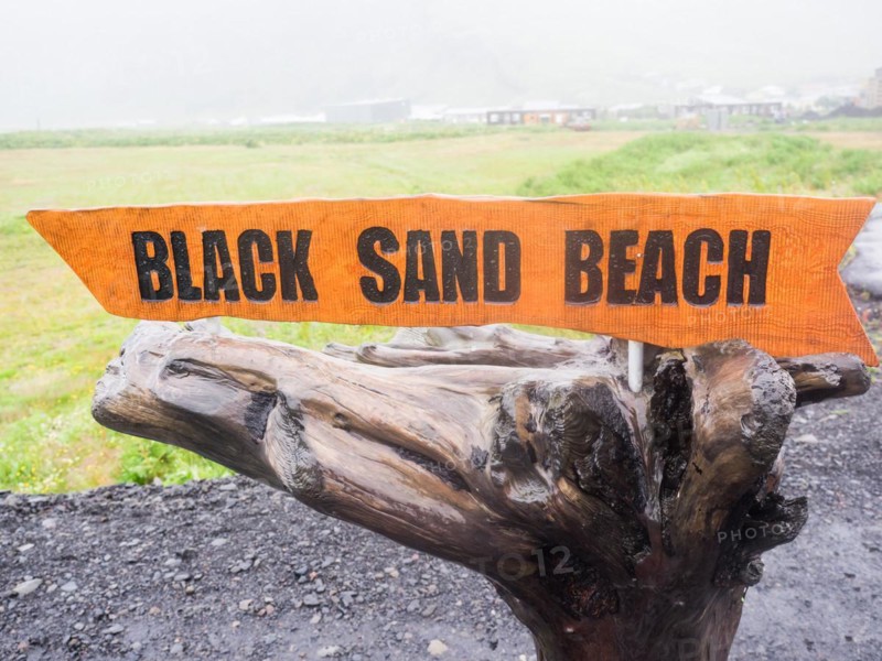 Rainy atmosphere, signpost to Reynisfjara beach, black lava beach, Vik, South Iceland, Iceland, Europe