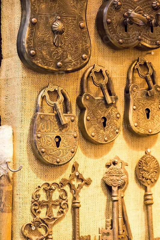 Retro styled keys and locks are hanging on a wall