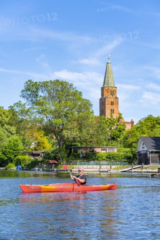 Paddler in a kayak in front of the Cathedral of St. Peter and Paul, Cathedral Island, Brandenburg an der Havel, Brandenburg, Germany, Europe