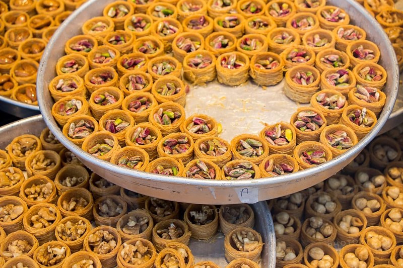 Nut stuffed dessert of mini size cuisine in hand