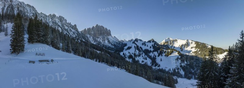 Hashtag Jaun, winter landscape below the Gastlosen and Marchzaehne, drone shot, Jaun, Fribourg, Switzerland, Europe