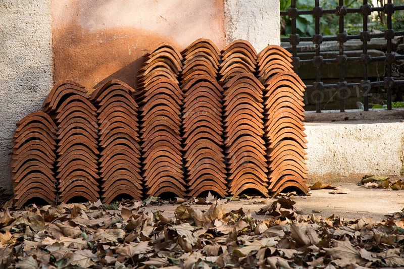 Pile of roofing tiles as a construction material at a building suppliers