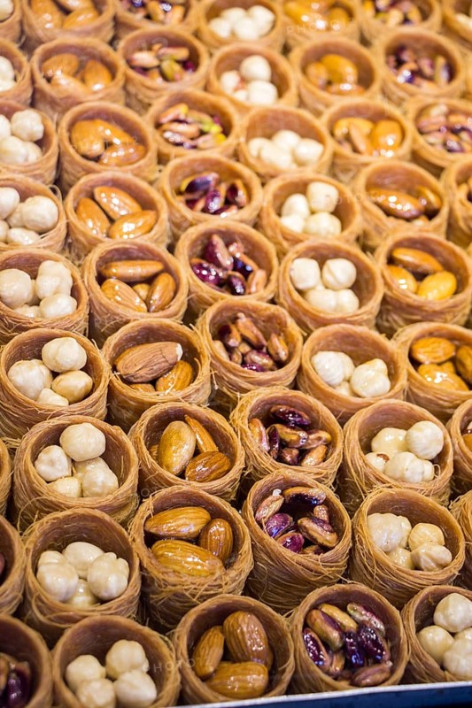 Nut stuffed dessert of mini size cuisine in hand