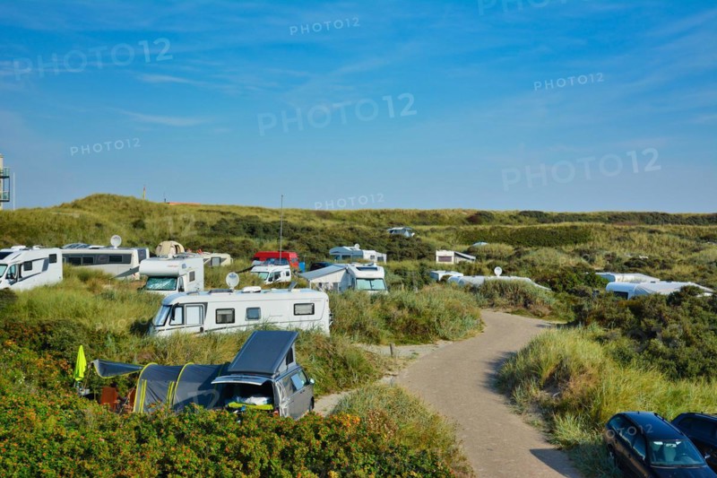 De Koog, Texel, Netherlands, August 2019: Camping site called Kogerstrand with big cars and camper vans in the dunes near beach on island Texel