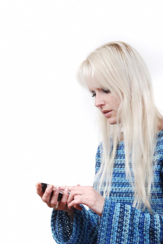 Portrait of blond woman phoning
