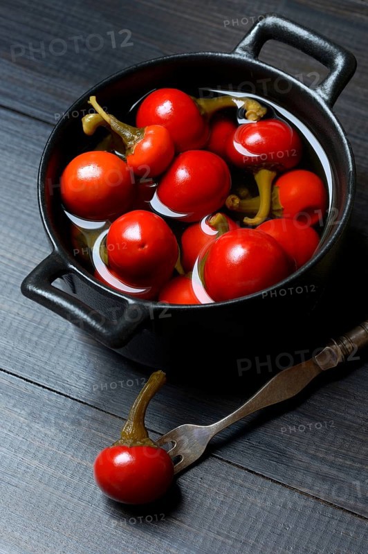 Potted cherry peppers in vinegar, chilli, paprika
