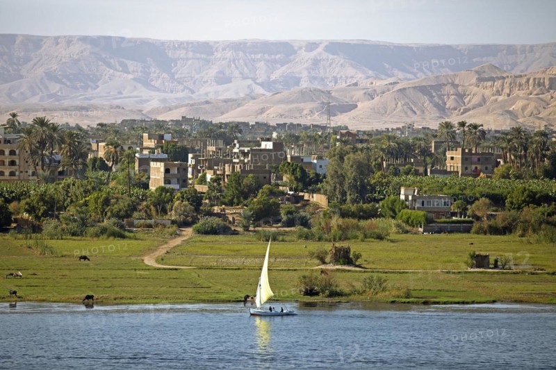 Felucca or traditional sailing boat on the Nile, behind Luxor and the Eastern Desert, Egypt, Africa