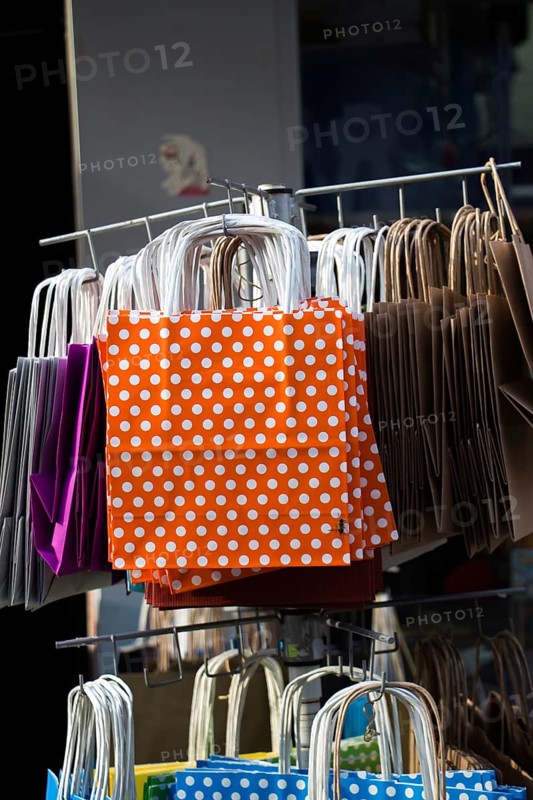One simple color paper shopping bag in the market place