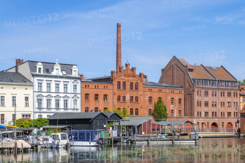 Boathouses, residential buildings and industrial architecture on Muehlendamm, Brandenburg an der Havel, Brandenburg, Germany, Europe