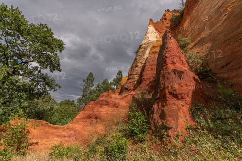 Red ocher cliff in the Luberon in Provence. Roussilon, Vaucluse, France, Europe