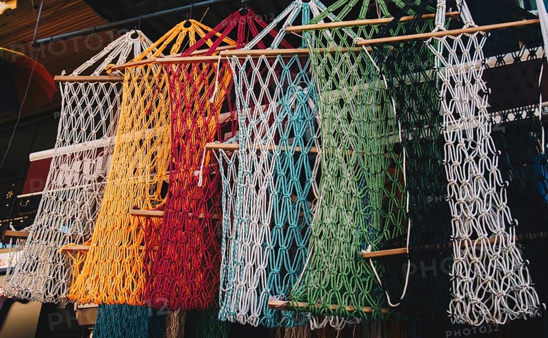 Empty mesh bags of various color at a market place