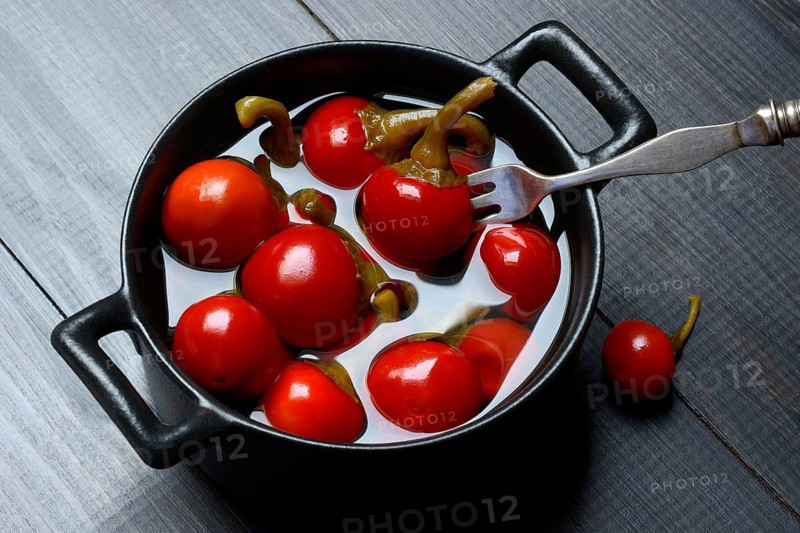 Potted cherry peppers in vinegar, chilli, paprika