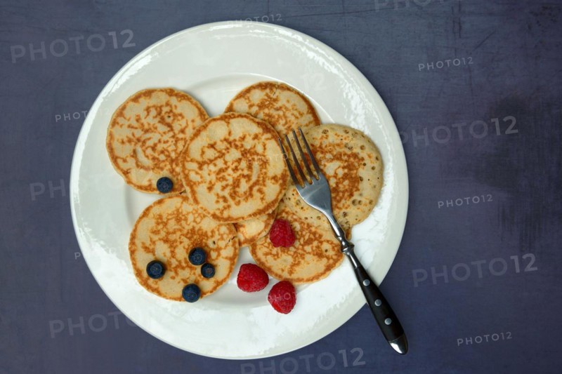 Blini, blinis on plate with fruit, mini pancakes