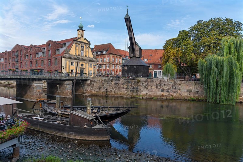 Old crane at the former port of Ilmenau, in front replica of medieval merchant ships, Lueneburg, Lower Saxony, Germany, Europe