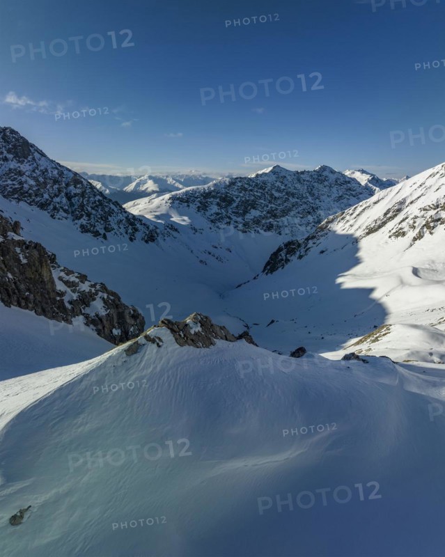 View over Strela Pass and rocky path to Strela summit and Haupter Taelli, drone shot, Davos, Grisons, Switzerland, Europe