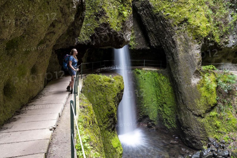 Hiker at Levada do Moinho, Waterfall in a gorge, Ponta do Sol, Madeira, Portugal, Europe