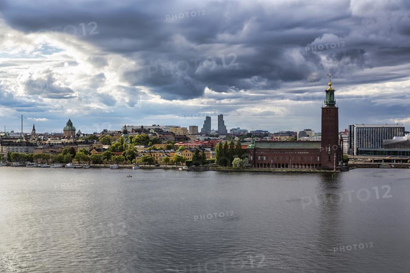 View from the viewpoint Monteliusvaegen to the island Kungsholmen with city hall Stockholms stadshus, dramatic cloudy sky, Stockholm, Maelaren, Sweden, Europe