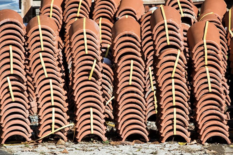 Pile of roofing tiles as a construction material at a building suppliers