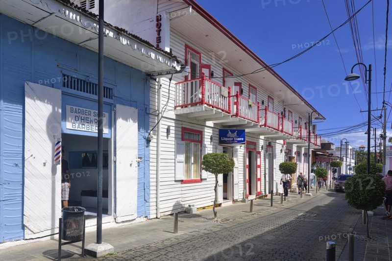 Hairdresser and liquor shop in a colonial house in the Centro Historico, Old Town of Puerto Plata, Dominican Republic, Caribbean, Central America