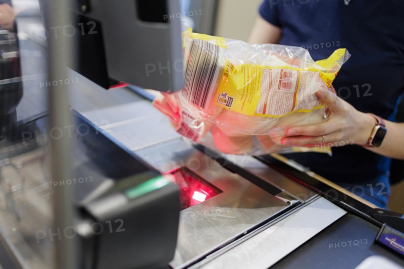 Elderly woman shopping in supermarket, Radevormwald, Germany, Europe