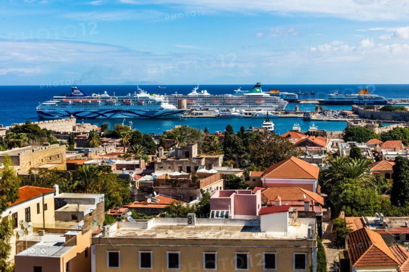 View of Mandraki harbour with cruise ships, Rhodes Town, Greece, Europe