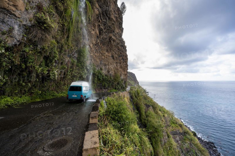 Cascata dos Anjos, car driving through waterfall, coastal road, Madeira, Portugal, Europe