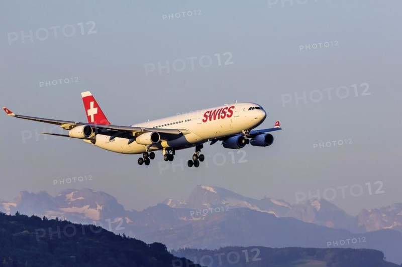 Airport ZRH with aircraft on approach of the airline Swiss, Airbus A340-300, Zurich, Switzerland, Europe