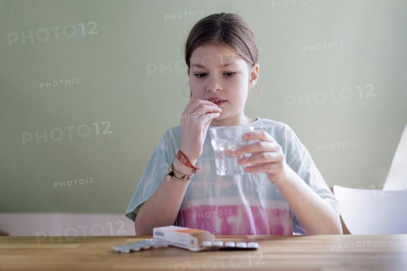 Ten-year-old girl with tablets, Bonn, Germany, Europe