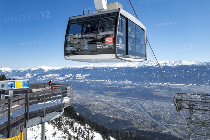 Seegruben cable car hovers over access to the Dreierstuetze chairlift, Nordkette ski area Innsbruck, Tyrol