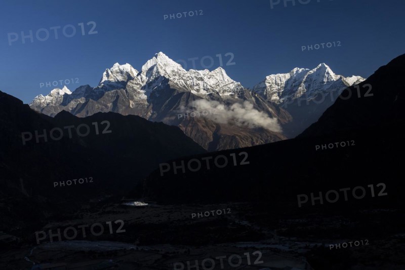 Mountain panorama seen from Thame village on an autumn evening with some high Himalayan peaks, including Malanphulan, Kangtega, Thamserku, Kusum Kanguru. Three Passes Trek. Khumbu, the Everest Region, Himalayas. Sagarmatha National Park, a UNESCO World Heritage Site. Solukhumbu, Nepal, Asia