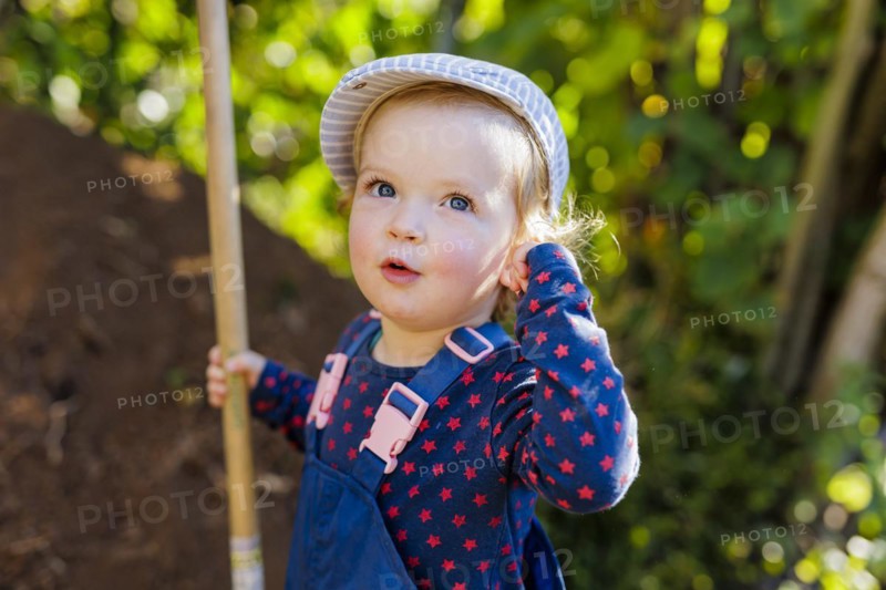 Portait of a toddler, with a shovel., Bonn, Germany, Europe