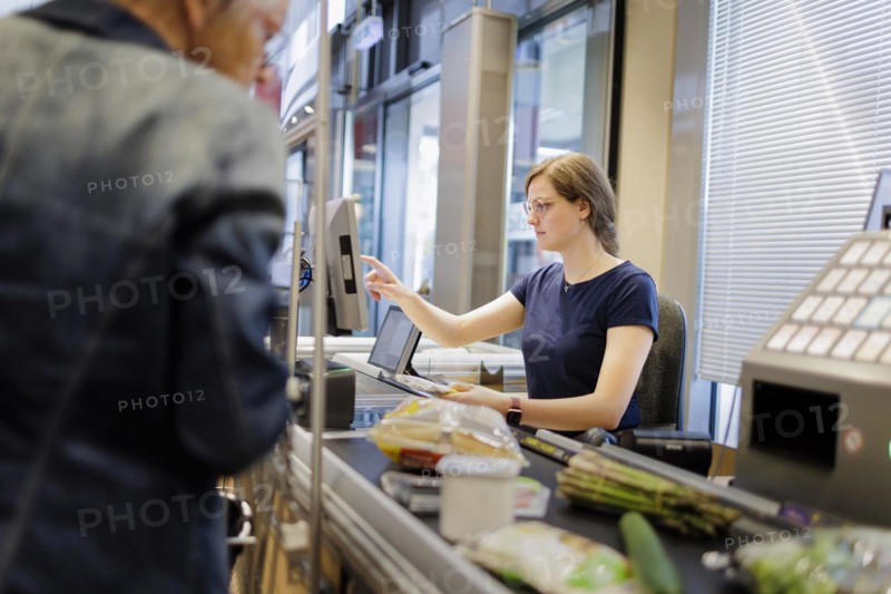 Cashier in a supermarket. Radevormwald, Germany, Europe