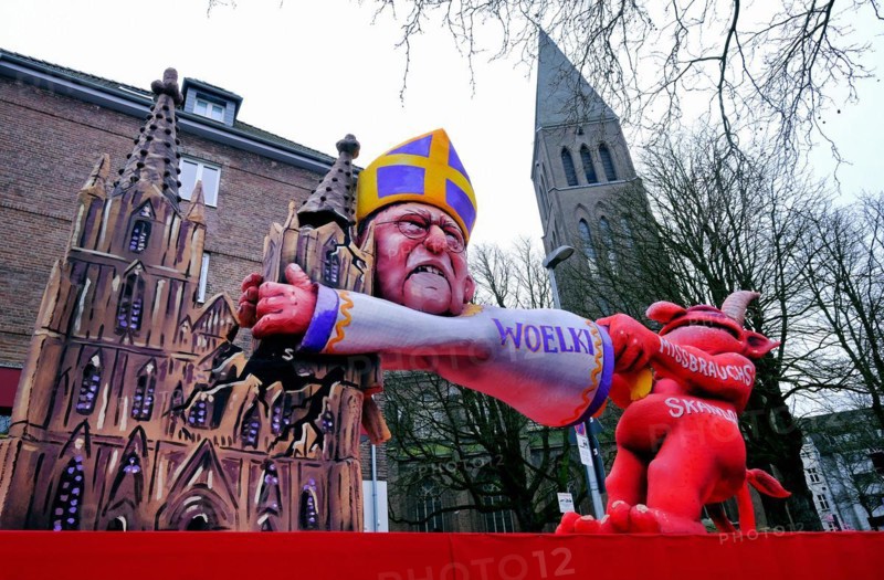 Theme floats by Jaques Tilly: Abuse scandal in the Catholic Church surrounding Cardinal Rainer Maria Woelki, Rosenmontagszug in Duesseldorf, North Rhine-Westphalia
