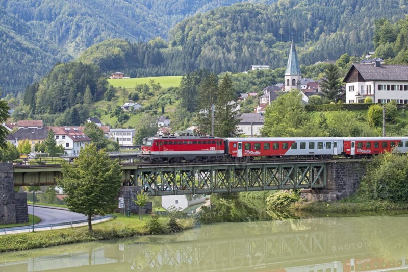 OeBB passenger train with electric locomotive 1042 on the Kronprinz Rudolfbahn on the bridge over the Enns in Reichraming, Upper Austria, Austria, Europe
