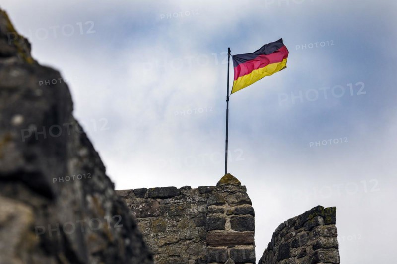 German flag of the town fortification from the 13th century, with town wall, battlements and witchs tower, Hillesheim, Rhineland-Palatinate, Germany, Europe