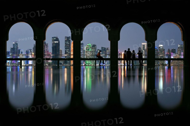 View of the illuminated skyline of Doha, Qatar, from the terrace of the Museum of Islamic Art by the archtics Ieoh Ming Pei and Jean-Michel Wilmotte, Asia