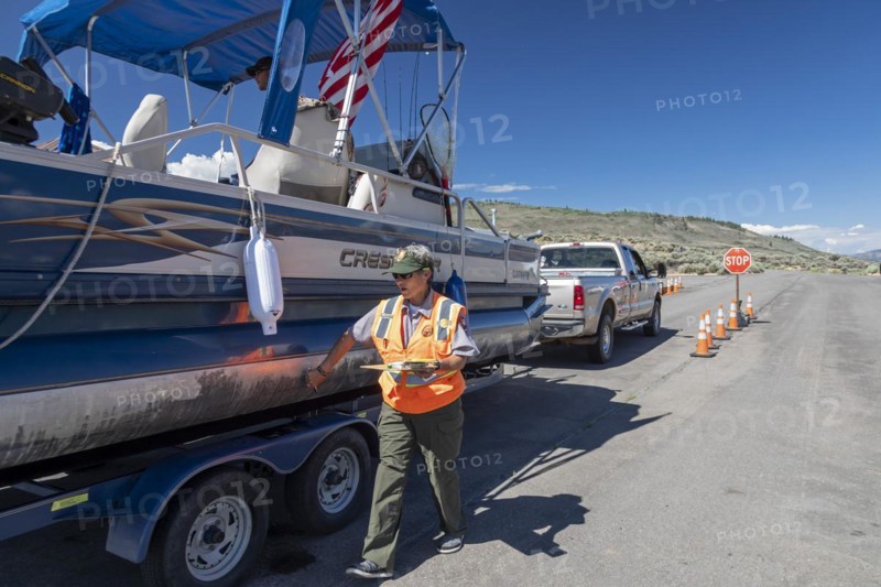 Gunnison, Colorado, Carol Soell, a boat inspector at Curecanti National Recreation Area, checks boats entering and leaving Blue Mesa Reservoir for invasive species. Colorados mandatory inspection program aims to keep zebra and quagga mussels, New Zealand mudsnails, Eurasian Watermilfoil, rusty crayfish, and waterfleas out of the states waters