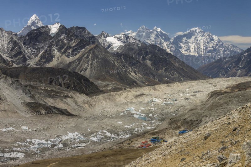 Mountain panorama seen from the trail leading toward the top of Kala Patthar above Gorakshep. The debris covered Khumbu Glacier is below and further down-valley are some six-thousands-plus peaks of the region including beautiful Ama Dablam, Thamserku and Khangtega. Khumbu, the Everest Region, Himalayas. Sagarmatha National Park, a UNESCO World Heritage Site. Solukhumbu, Nepal, Asia