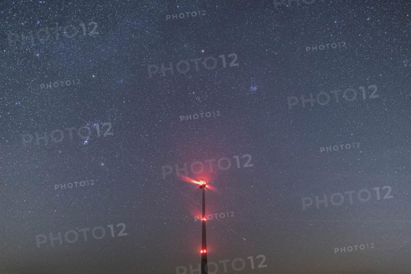 An illuminated wind turbine stands out against the starry sky in Vierkirchen, 14.02.2023., Vierkirchen, Germany, Europe