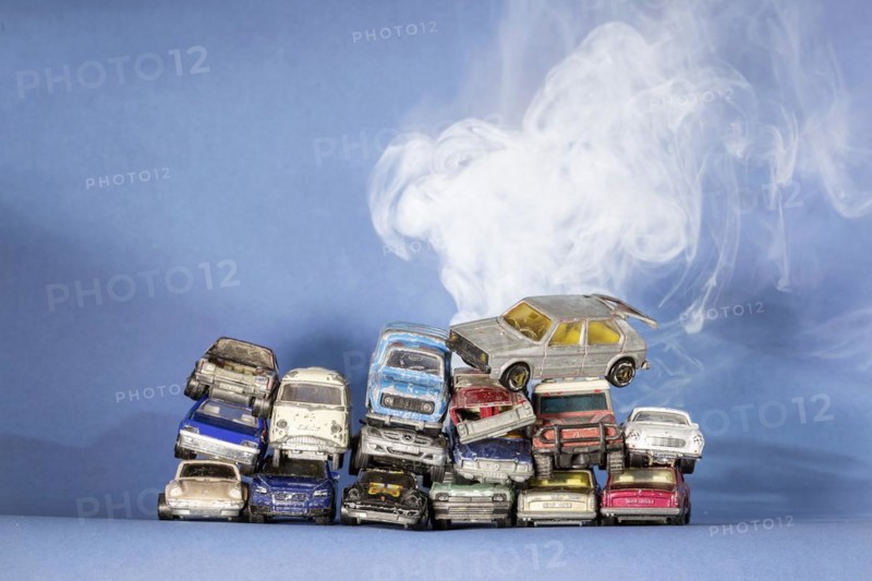 Symbol photo scrap cars, broken Matchbox toy vehicles, climate change, studio shot, Germany, Europe
