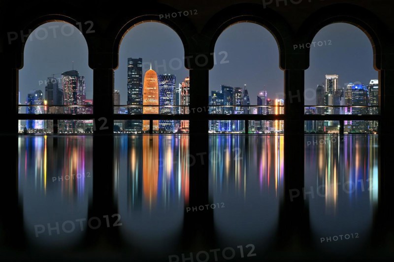 View of the illuminated skyline of Doha, Qatar, from the terrace of the Museum of Islamic Art by the archtics Ieoh Ming Pei and Jean-Michel Wilmotte, Asia