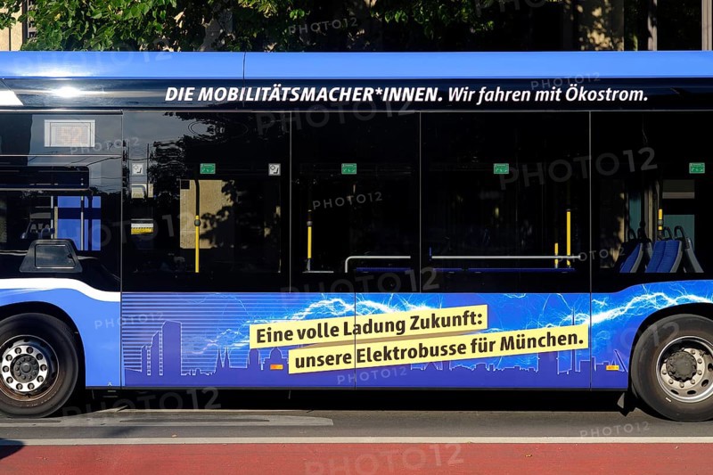 Advertisement for e-mobility on an electric bus, e-bus of MVG, Muenchner Verkehrsgesellschaft, side view, Munich, Bavaria, Germany, Europe