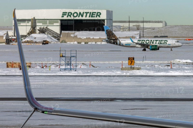 Denver, Colorado, A Frontier Airlines jet on the ground after a snowstorm at Denver International Airport