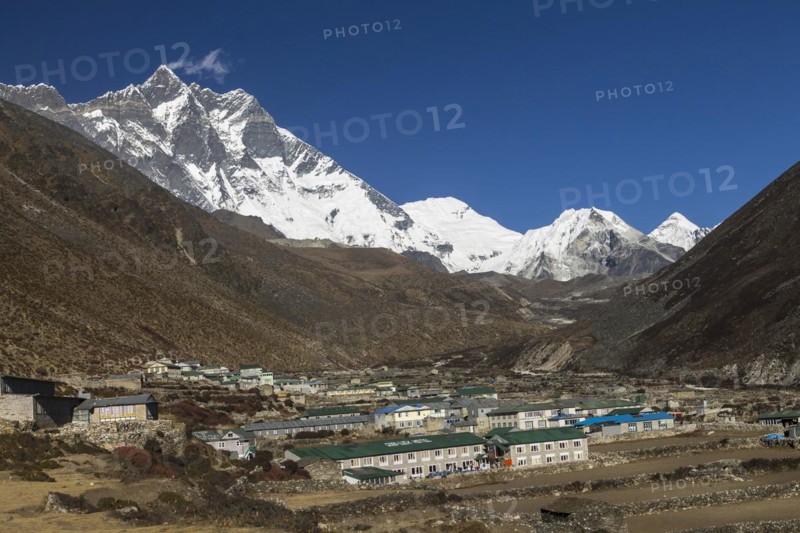 Dingboche settlement, located in the Imja Khola Valley, at the foot of the eight-thousander Lhotse, with its huge mountaineering challenge, the Lhotse South Face. Other peaks belonging to the main Himalayan ridge, Shartse and Cho Polu, are further up-valley as well as Imja Tse, also known as Island Peak, the popular trekking peak. The Himalayas, the Everest Region known as Khumbu Region. Sagarmatha National Park, a UNESCO World Heritage Site. Solukhumbu, Nepal, Asia