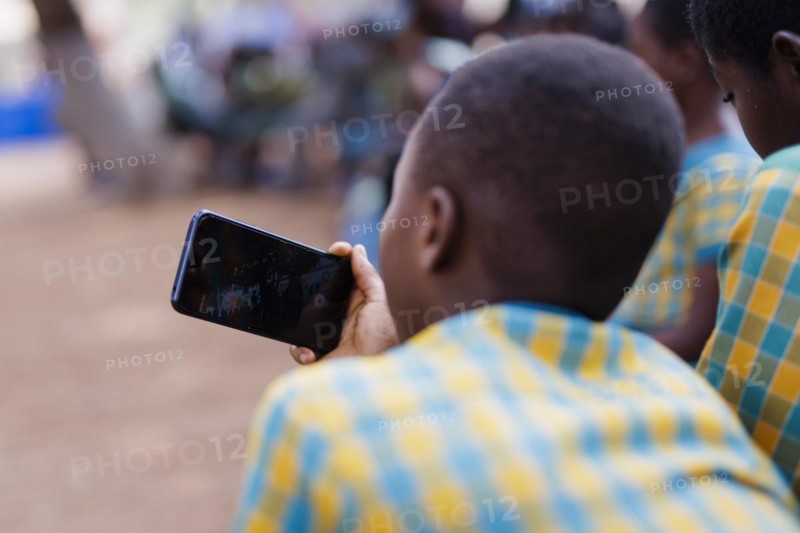 Topic: Child with smartphone in Africa., Krokrobite, Ghana, Africa